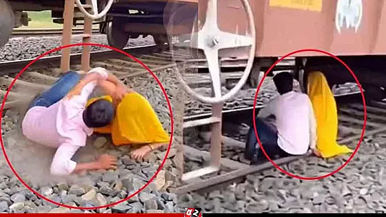 ট্রেনের নিচে ঘনিষ্ঠ মুহূর্তে হঠাৎ বেজে উঠলো হুইসেল!